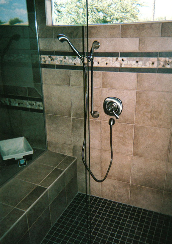 shower remodel with new tile and handheld shower tap