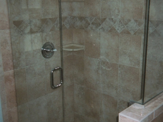 shower remodel with new tile and glass doors
